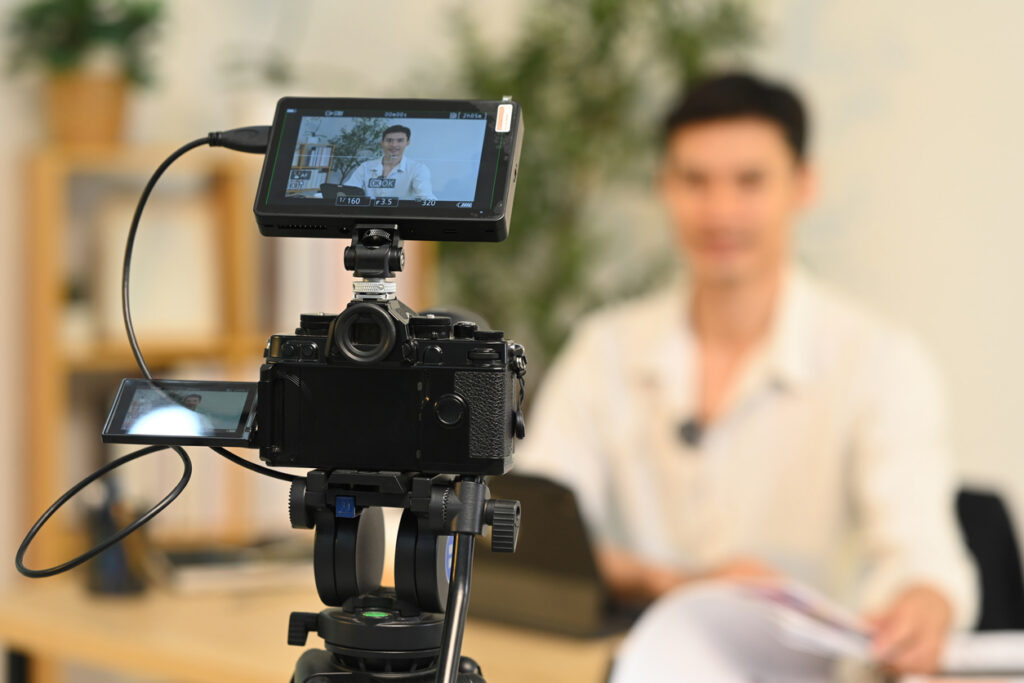 Fintech founder filming a brand story video in a professional Australian corporate environment.
