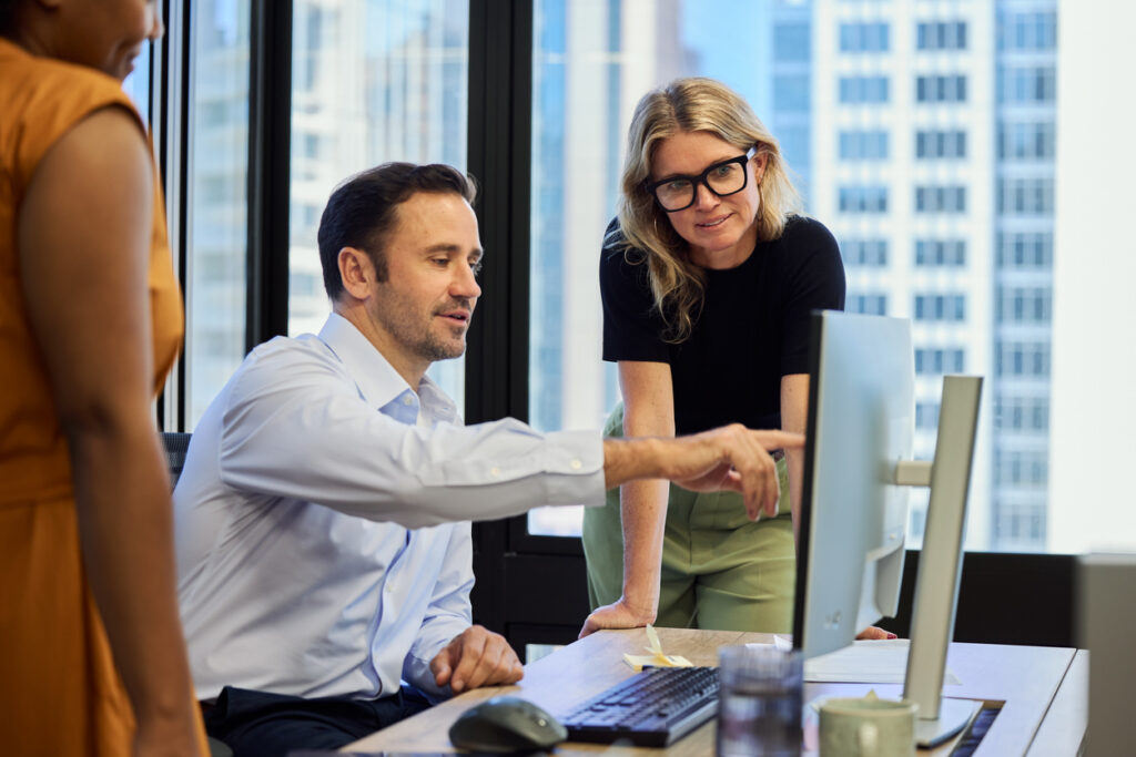 Financial services compliance review of a corporate video production in a modern Australian office.